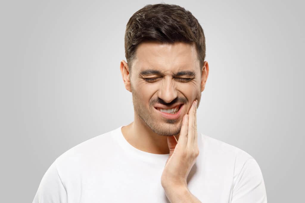 When to Worry: Signs Your Toothache Requires a Dentist Dentist for a Toothache in Dallas. PCDC. Invisalign, General, Cosmetic, Restorative, Family Dentistry in Dallas TX 75225 Call:214-382-9972 guy holding jaw in pain Dental Veneers DR. Justin Moseley. Moseley Dental Group. General, Cosmetic, Restorative, Preventative Dentistry Dentist in Dallas TX 752253